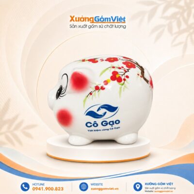Heo đất tiết kiệm truyền thống dáng mập tròn mi cong vẽ hoa đào đỏ in logo HĐ-09